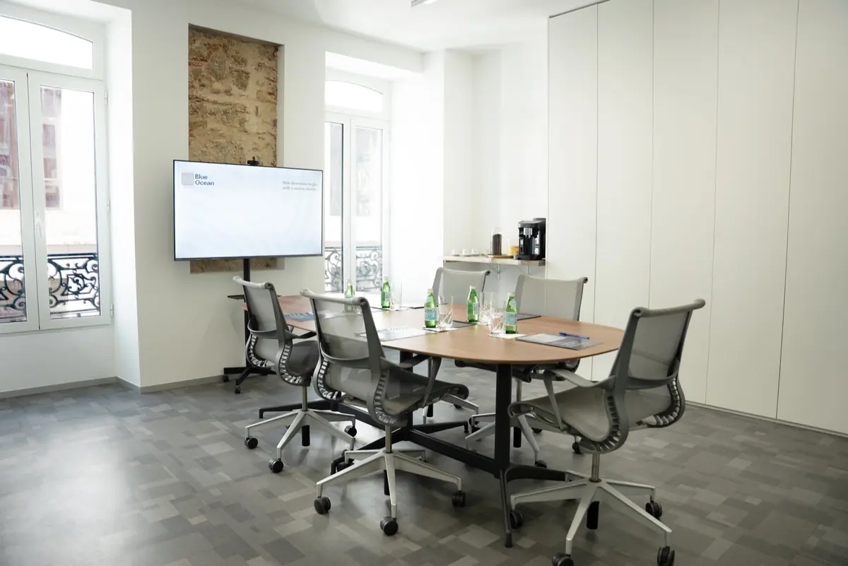 Meeting room at the Blue Ocean office in Lisbon, with tall windows onto Avenida da Liberdade